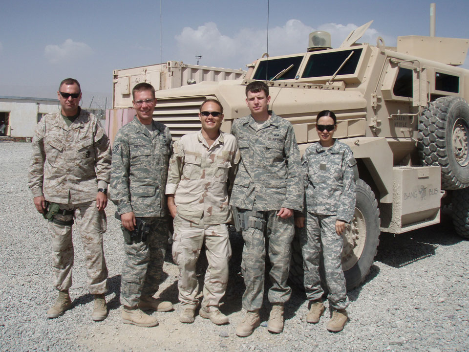Adam with his EOD teammate, Combined Explosives Exploitation Cell members, and their translator.