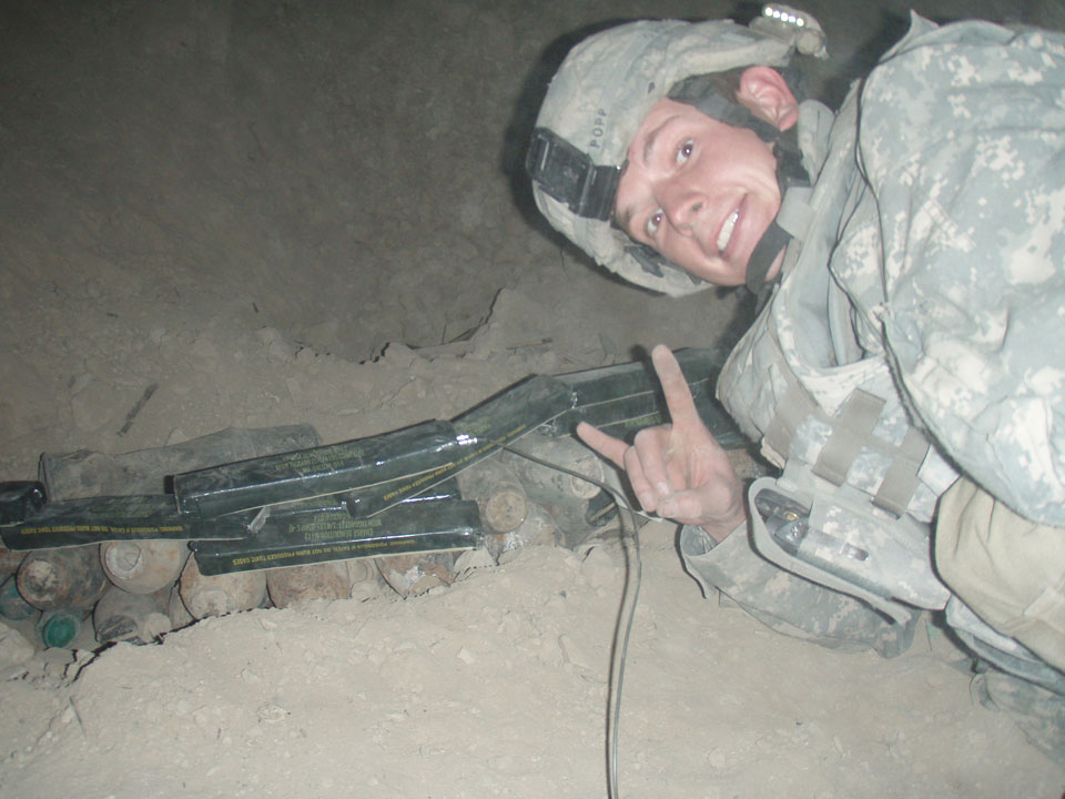 Adam disposing of mortars in the mountains of Afghanistan.