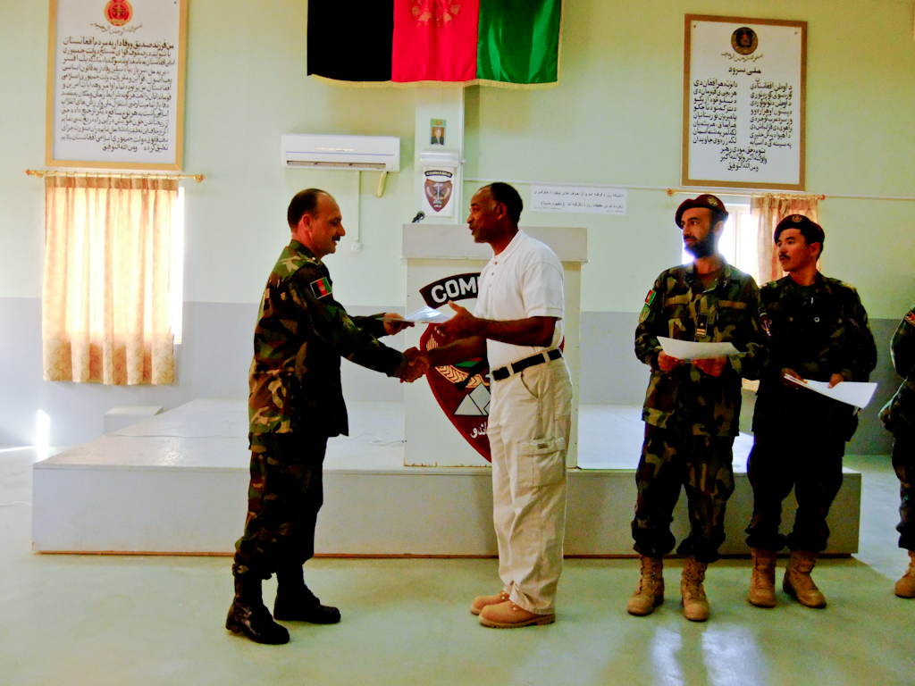 Receiving his leadership award from 3rd Commando BDE. Commander Kandahar Airbase, Afghanistan, 2011