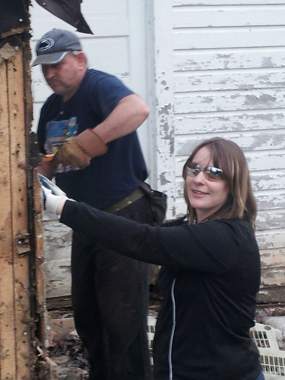 Dan and his daughter/nominator, Ashley tearing down an old garage.
