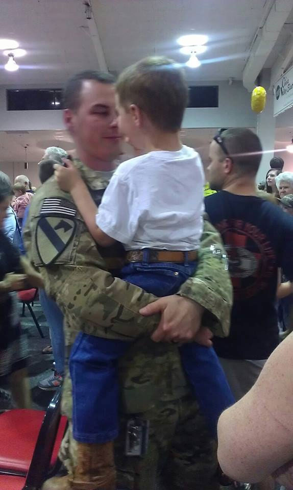 David embracing his son after a long deployment.