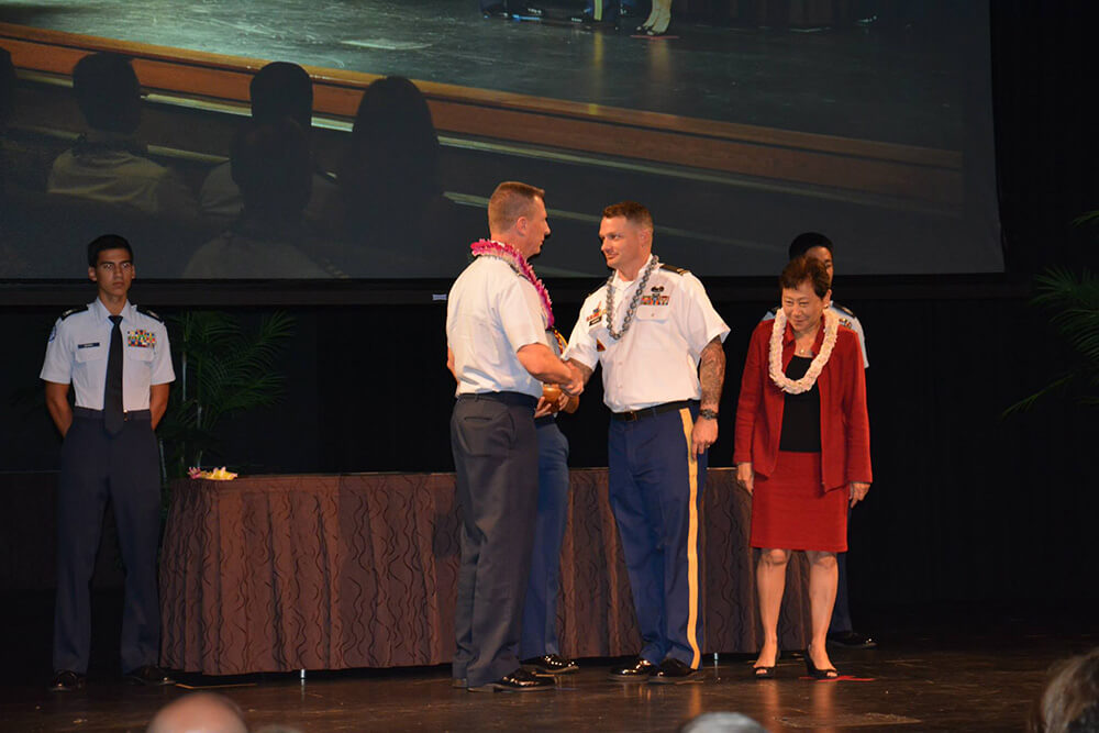 Keith receiving an award from the Pacific Command Chief of Staff and the Hawaii Department of Education Superintendent