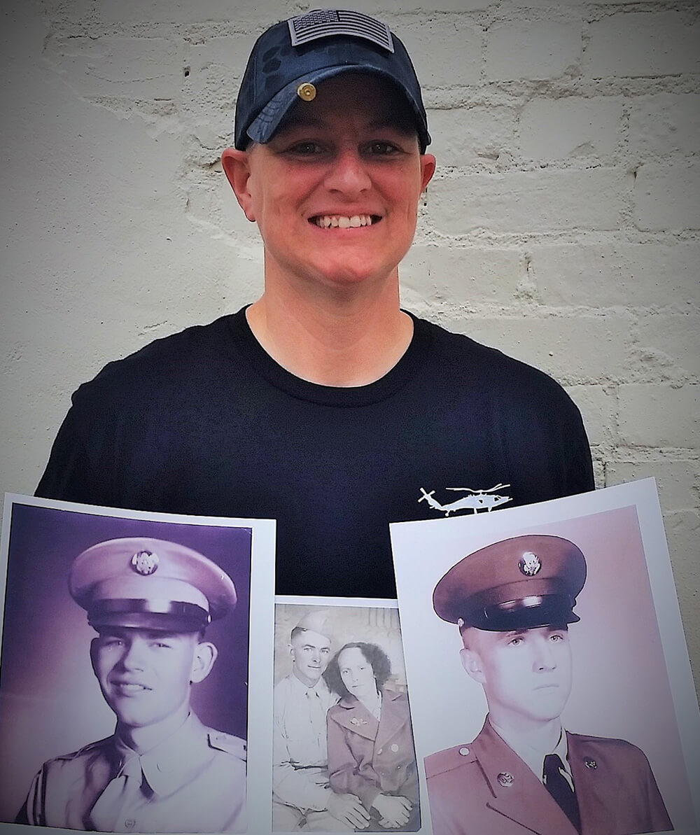 Lori with her grandfather’s photos, also veterans
