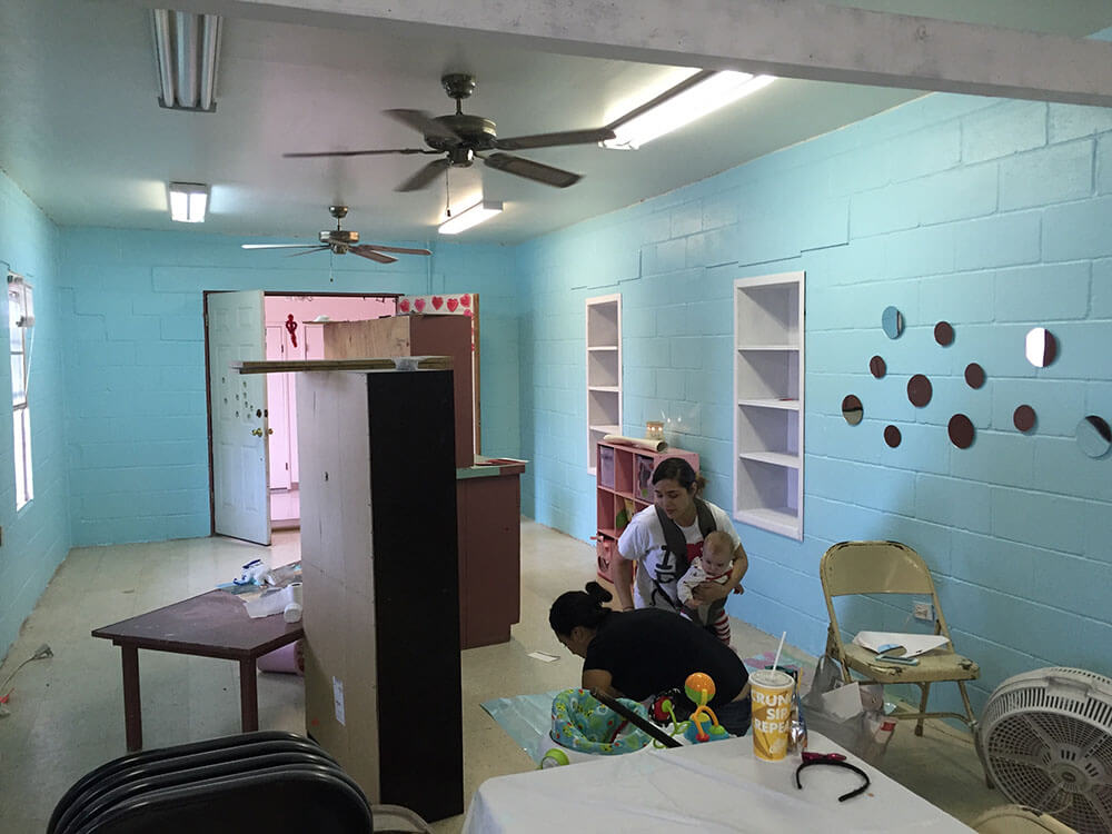 Ruby painting and redecorating the classroom for her Sunday School children