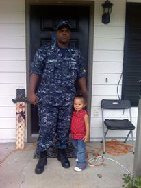 Brent with his daughter in his new work uniform.