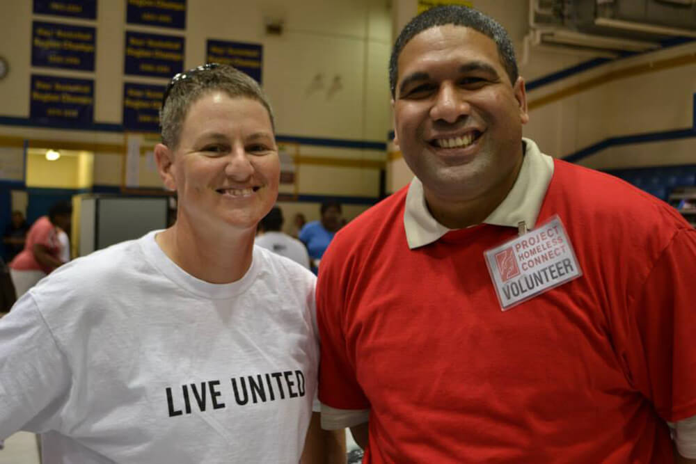 Lori at Project Homeless Connect with a fellow veteran