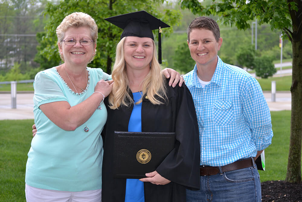 Lori at her sister’s graduation with their mother