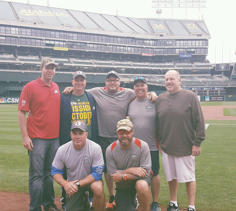 Helping Hands For Freedom Walk Across America Team throwing out 1st pitch at Oakland A's game.