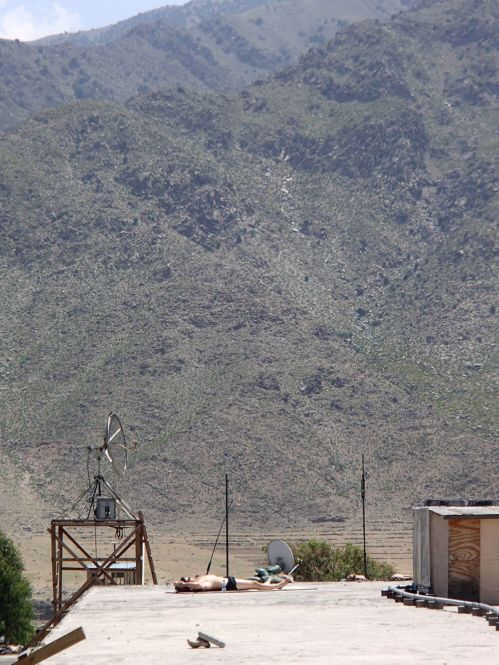 William sun tanning in Afghanistan